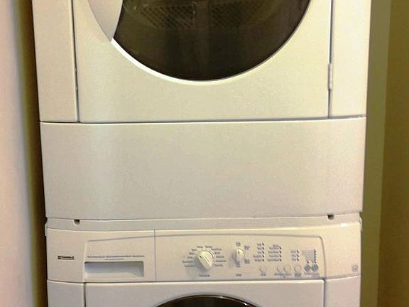Stacked washer/dryer in the laundry room off the kitchen