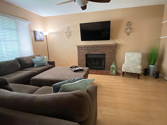 Cozy living room for space with large sectional & flat screen tv. On the left side can fit more seating, storage & so much more!