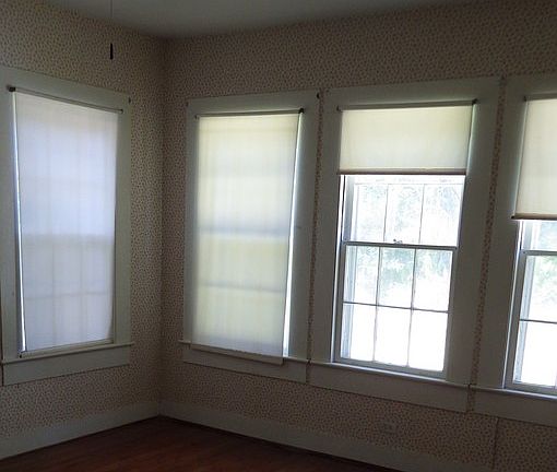 Bedroom : Large, 4 window bedroom with wooden floors