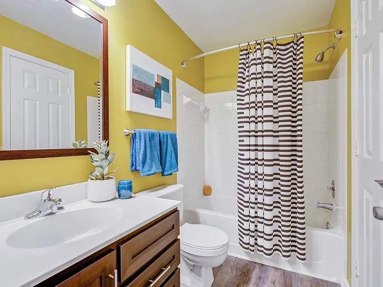 Well-appointed bathrooms are complete with ample storage.