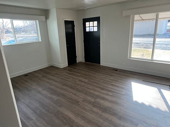 front door in family room with tons of natural light, we also added recessed lighting throughout the house.