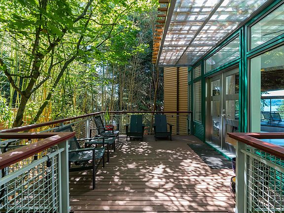Front porch with covered entry way. A wall of windows and doors, welcomes you home!