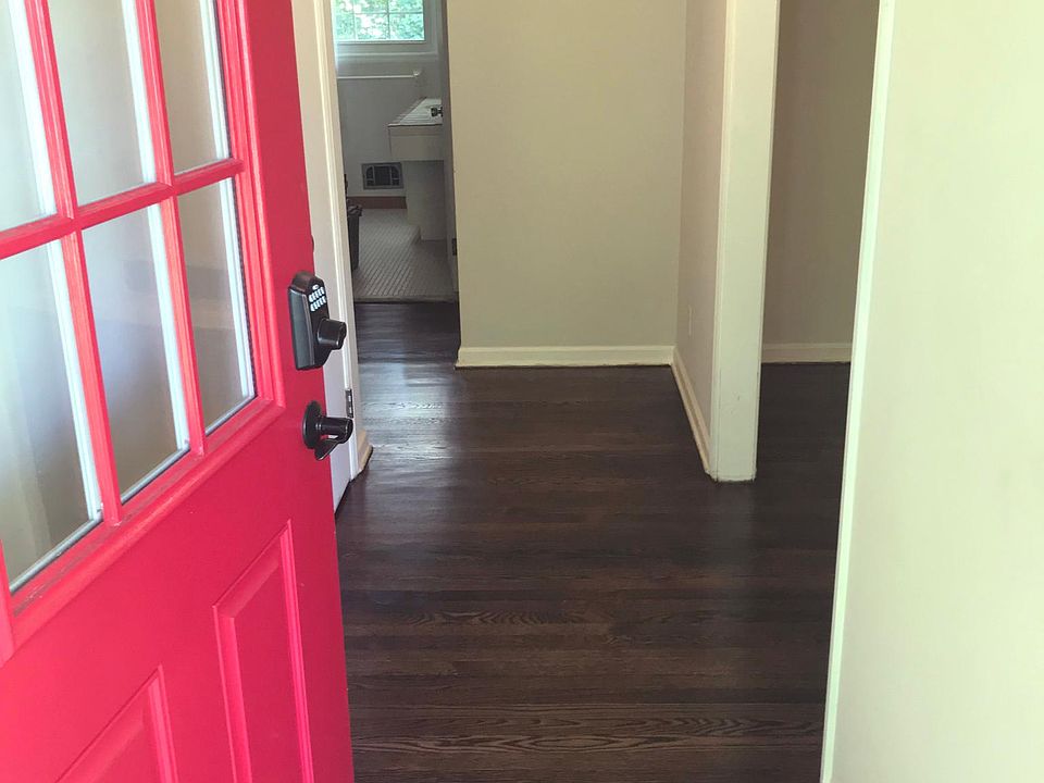 Red door greets you at the foyer.  Original hardwoods floors
