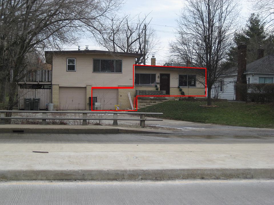 Rental unit to side of garages.