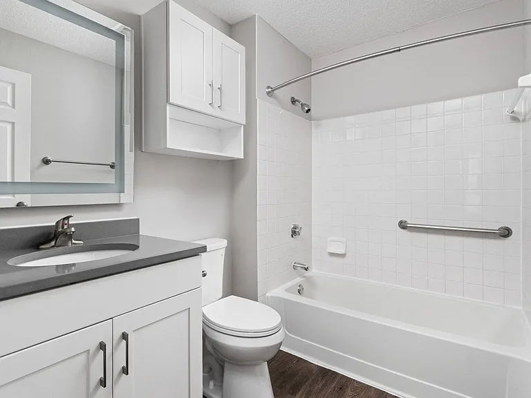 Bathroom with white vanity and quartz countertops