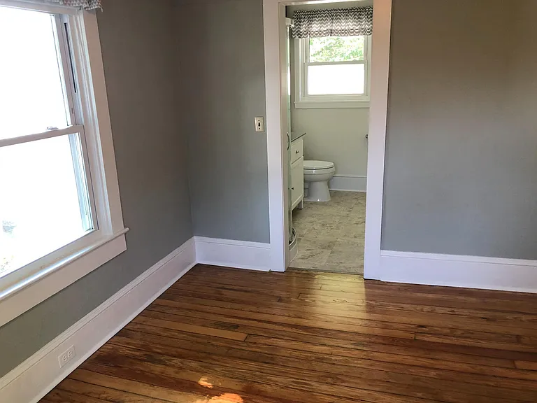 Bedroom, view into bathroom.