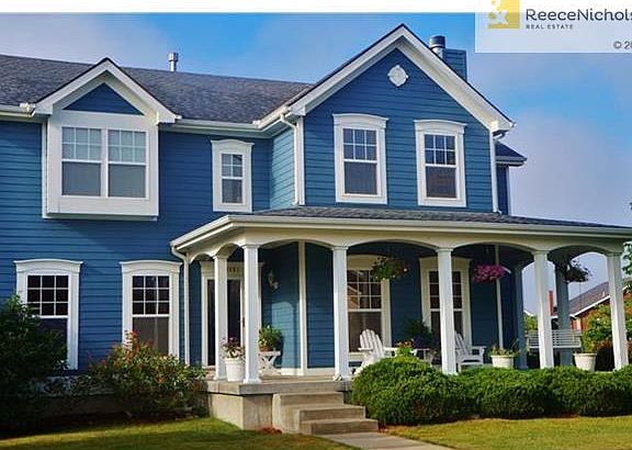 Absolutely darling 2-story home with spacious and relaxing veranda style porch.