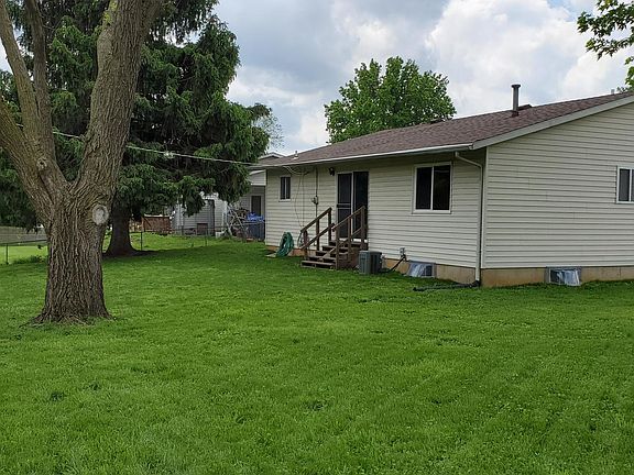 back view, patio door, walking path and yard