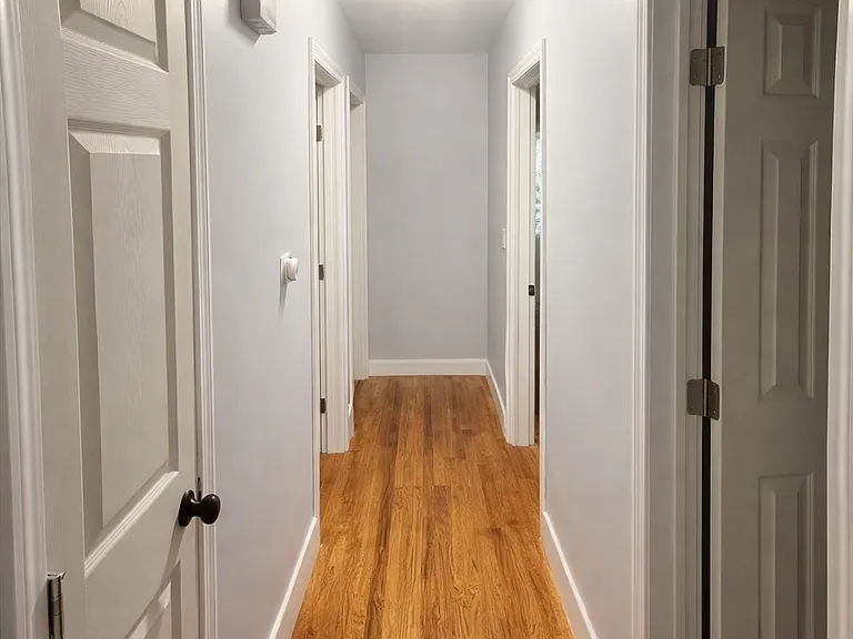 Hallway leading to bedrooms and bathroom