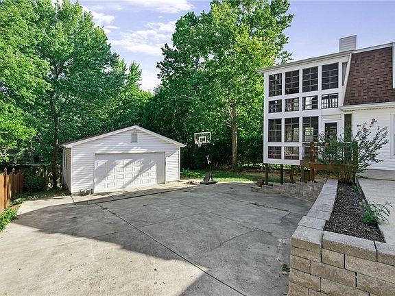 Oversized detached garage, private backyard and 2-story screened in patios.
