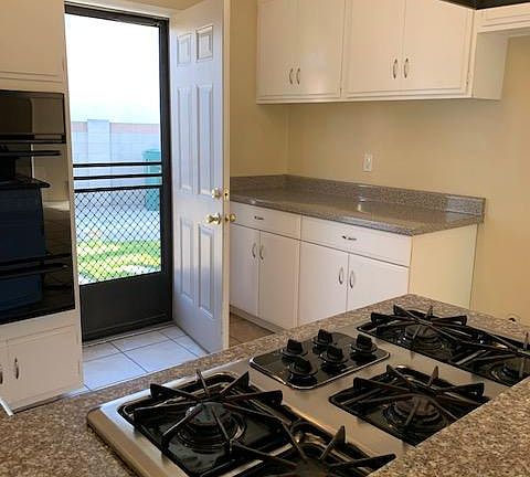 Kitchen storage space and door to side yard to enjoy the Huntington Beach afternoon breezes!
