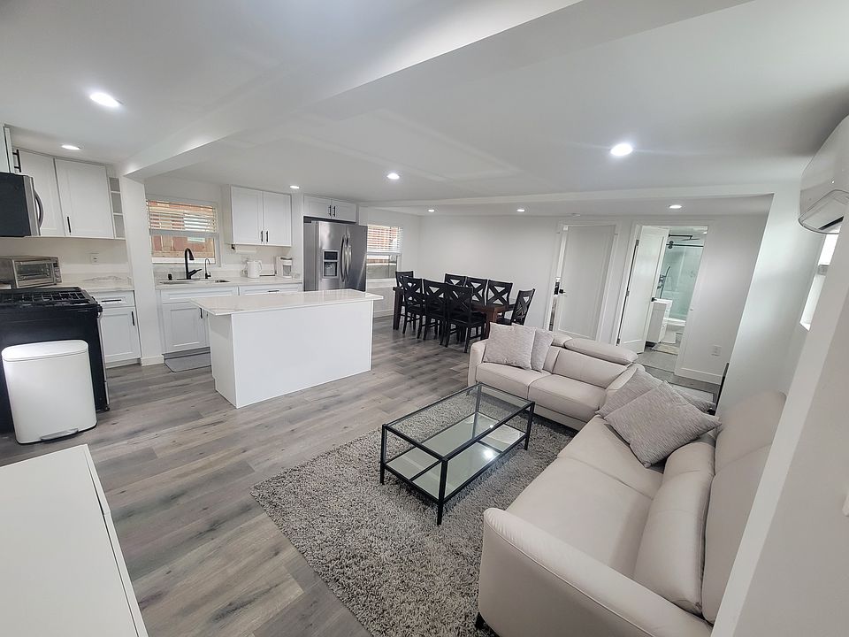Large living room, dining room, and kitchen open layout. Perfect for hosting.