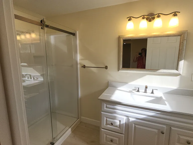 Walk-in shower and large cabinet