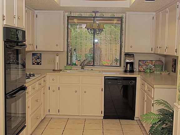 Light and Bright Kitchen Overlooks the Pool
