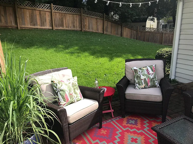 Partial view of patio & yard with 5 foot fence