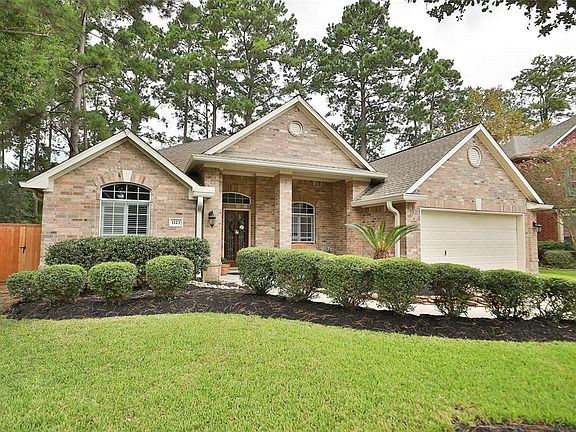 Fresh mulch and rock gives this landscape a facelift and says "Welcome home"! Large covered front porch.