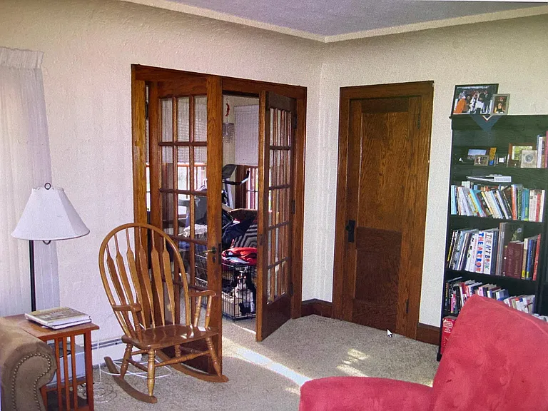 Living room showing closet for winter coats/storage
