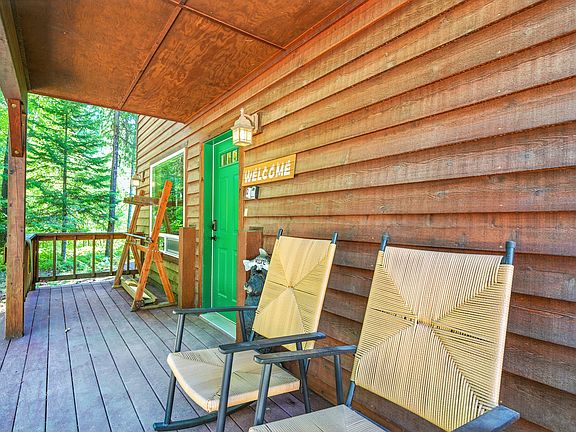 Rocking chairs face Little Sand Creek.