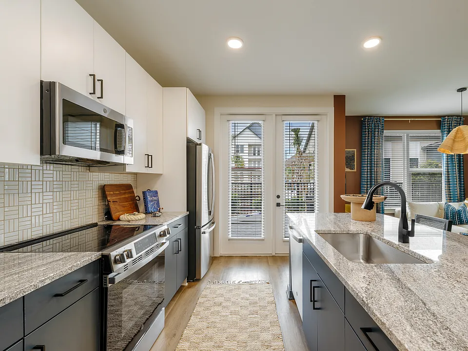 Modern kitchens with granite counters and stainless steel appliances