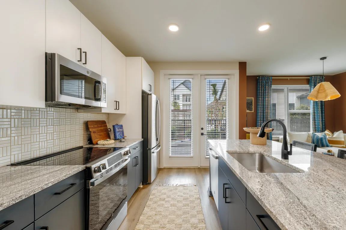 Modern kitchens with granite counters and stainless steel appliances