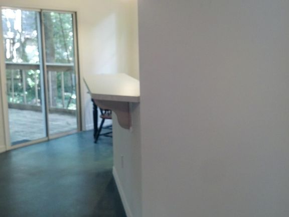 Bar at kitchen next to large livingroom