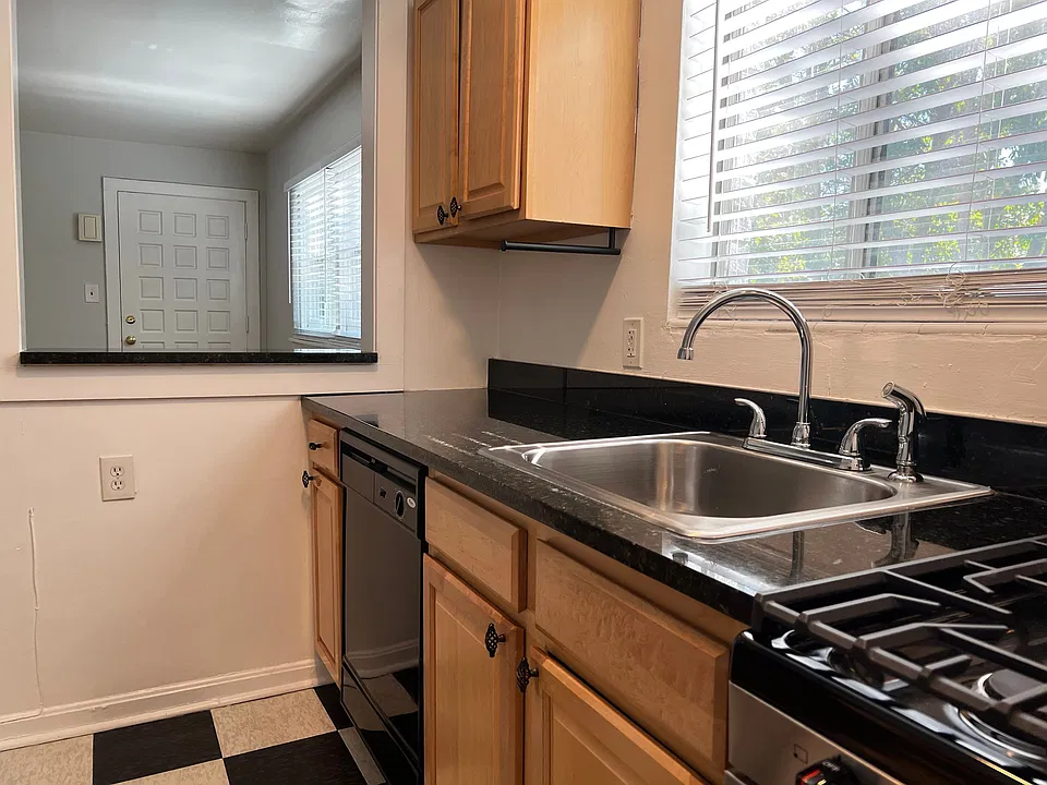 Stone countertops, gas stove, and dishwasher!