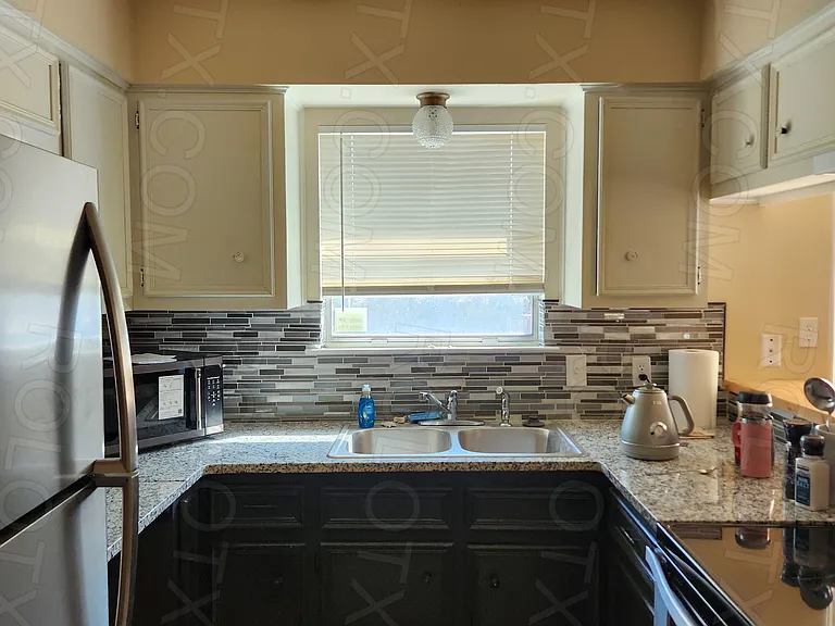 Kitchen: micrwave, coffee maker, range/oven, fridge, dishwasher and utensils/plates.
