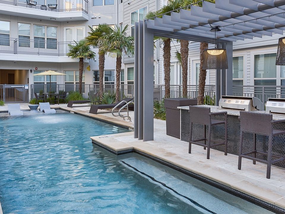 The poolside grilling station and dining island make for a great place to entertain friends and family