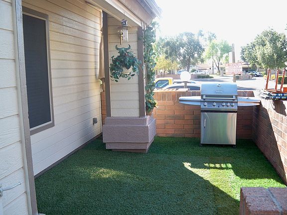Cozy front patio with pregra grass