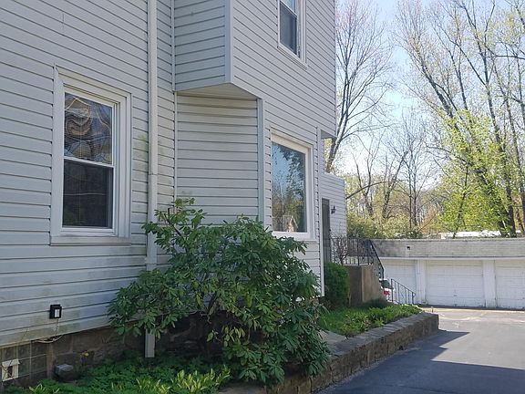 Side of apartment building and parking in the back