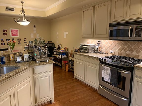 Tons of cabinets in the kitchen.