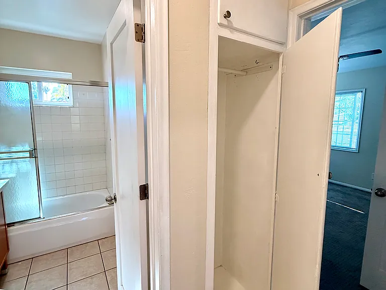 Hallway utility cabinet for extra storage.