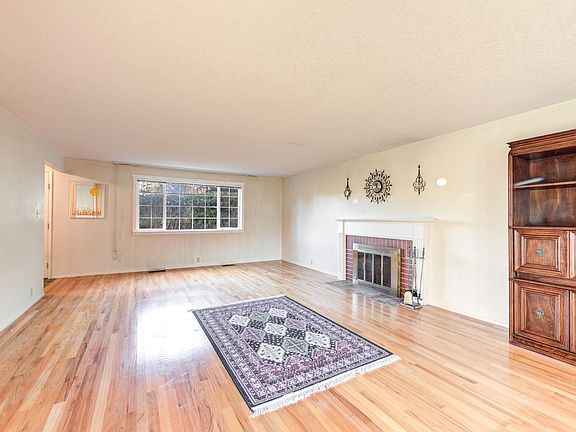 Formal Living Room with wood burning fireplace.