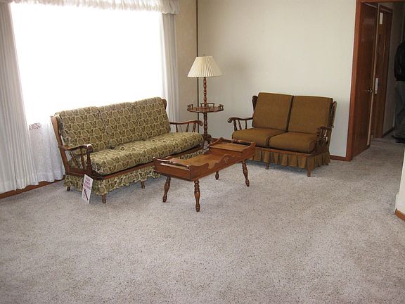 Formal living room with newer carpet, tiled entry & large walk-in closet!