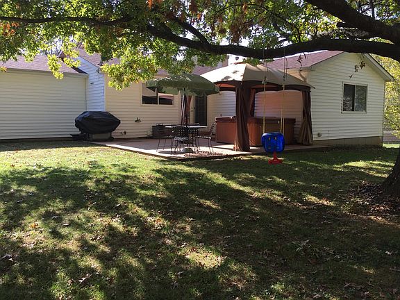 Large, shaded, fenced-in backyard
