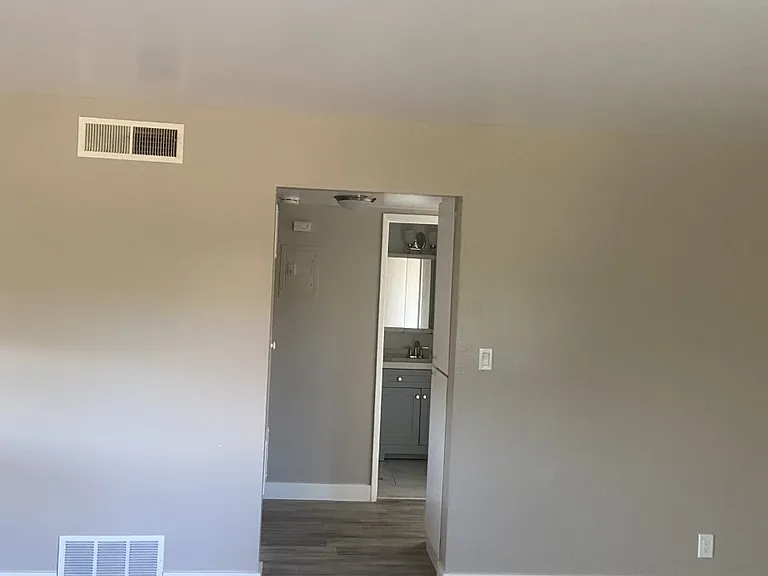 Enjoy two-tone paint throughout, central heat and air, and beautifully updated bathrooms with new tubs, vanities, mirrors, and lighting. Convenient hallway closets offer extra storage.