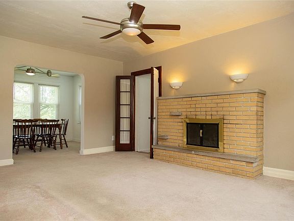 The living room is 17 x 13 & has a gas fireplace. Straight ahead is the dining room and through the french doors is bedroom #2.