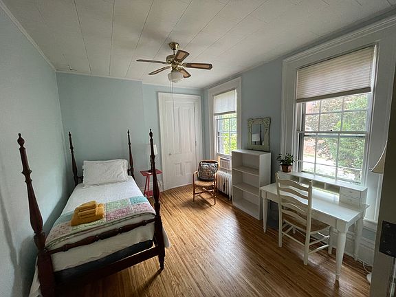 front bedroom with two large windows and one closet.