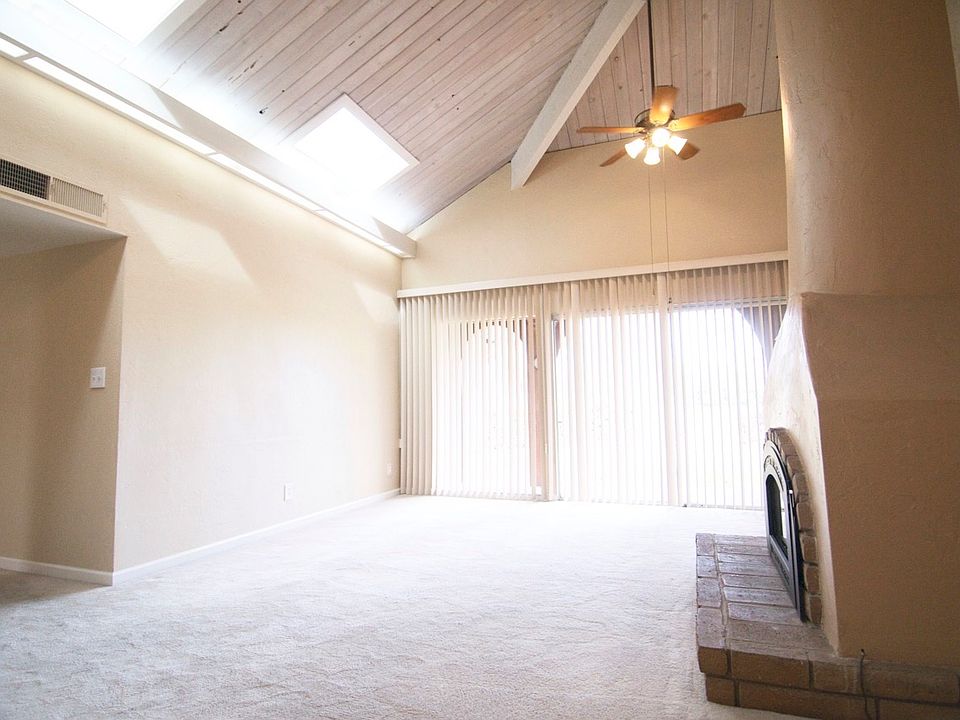 Great room with skylights and ceiling fans