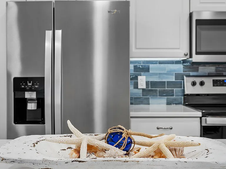 Stainless appliances and beautiful backsplash