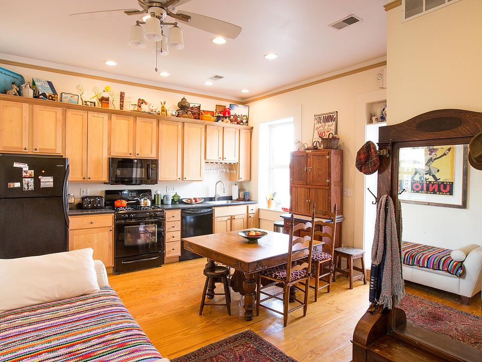 Kitchen and dining area, with maple cabinets and real pine wood floors.