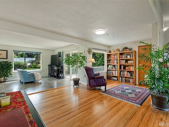 Love the library off the kitchen.  What a charming place to sit and read