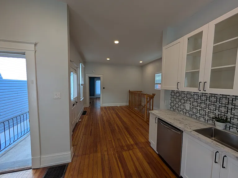 Open Kitchen looks out onto living room