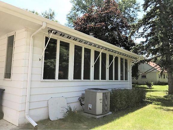 large sun room with Windows on 3 sides