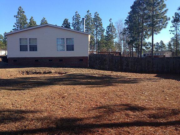 House from the side (captures a bit of the deck)