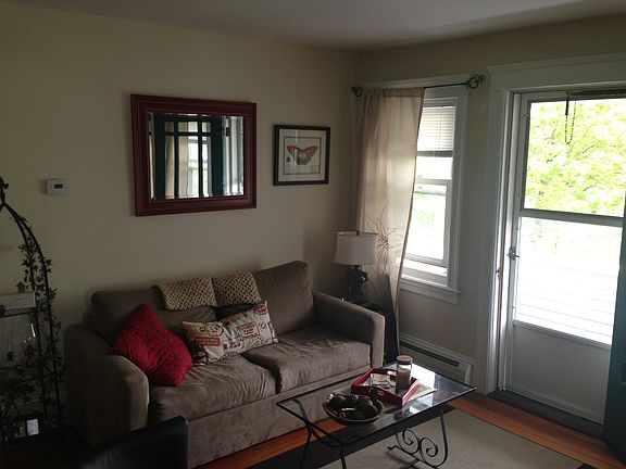 view to living room corner and access to balcony.