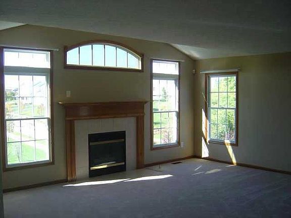 Family room has transom windows, fireplace, and is wired for 5.1 speakers.