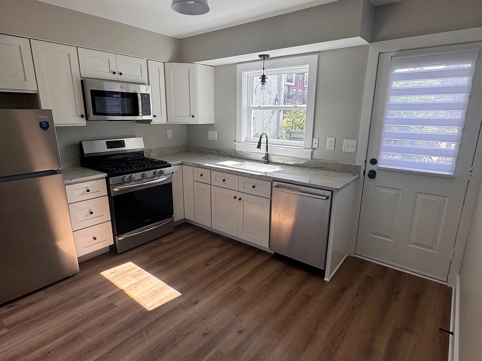 Kitchen with access to small patio