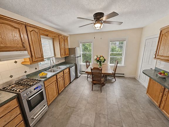 Eat in kitchen with stainless steel appliances and lot of cabinet space