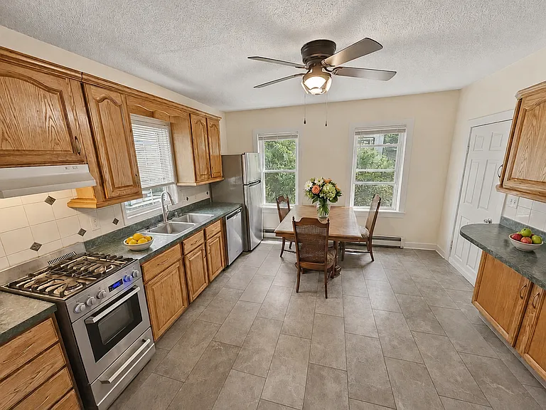 Eat in kitchen with stainless steel appliances and lot of cabinet space